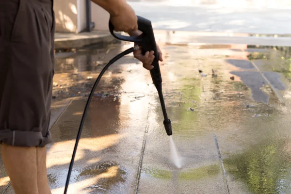 man-cleaning-stone-with-high-pressure-water-jet-at-2025-10-16-06-34-10-utc_2_11zon